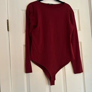 Women’s XL long sleeve maroon bodysuit. New without tags!